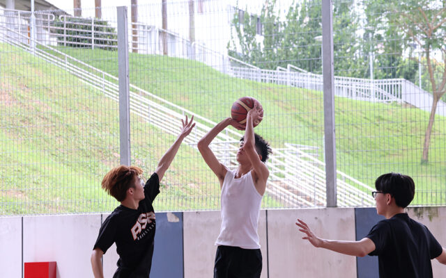 Students playing basketball